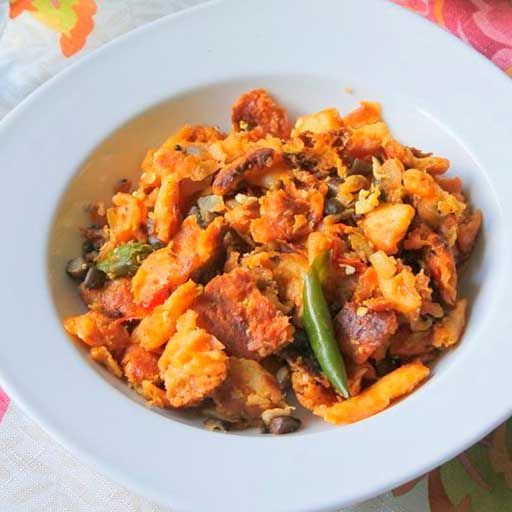 A bowl of mushroom kottu — chopped roti tossed with vegetables and green chilli